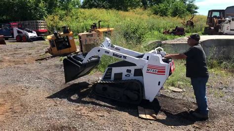 demo barn with skid steer|walk behind skid loader.